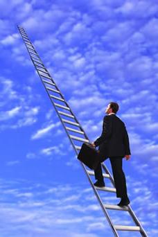 Business person climbing ladder